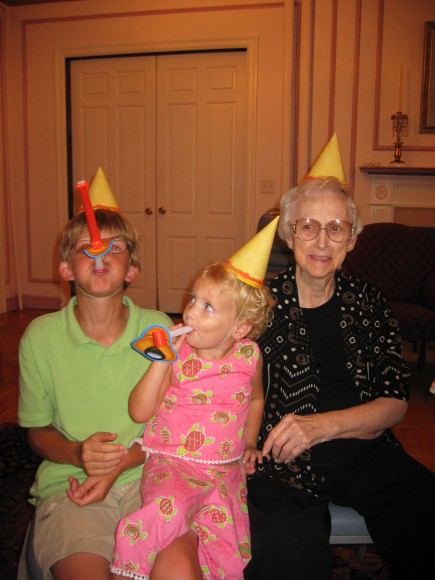 Birthday party hats on my son, my niece and my Grandma.